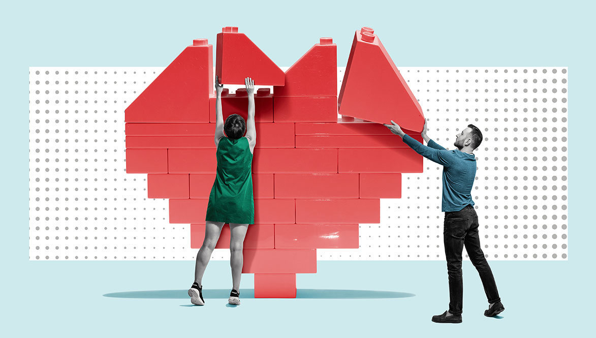 man and woman building heart