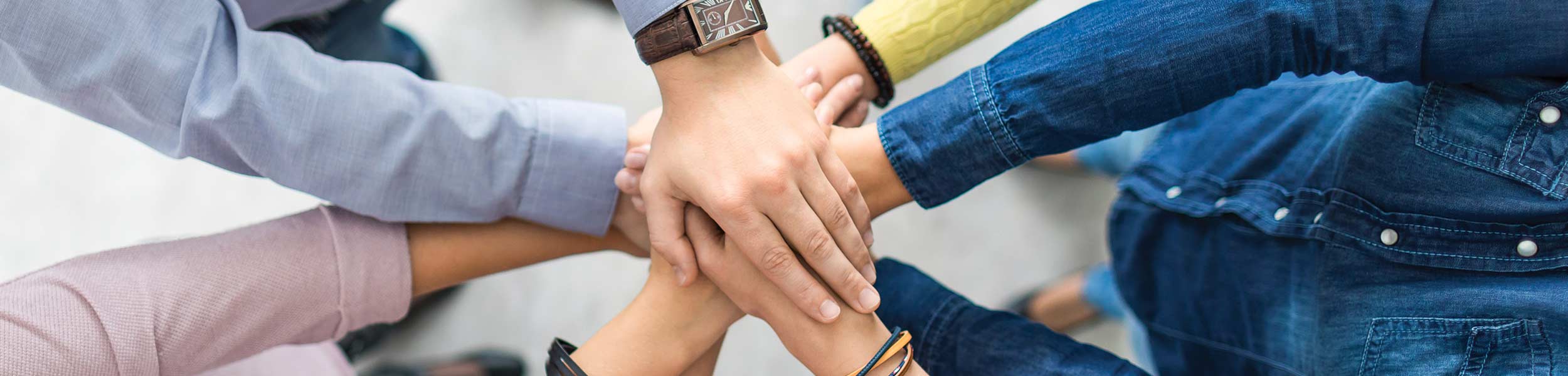 Membership Plan - hands together in group