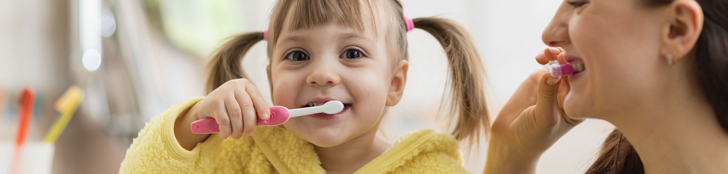 Dental & Vision Plan Main - kid and mom brushing teeth